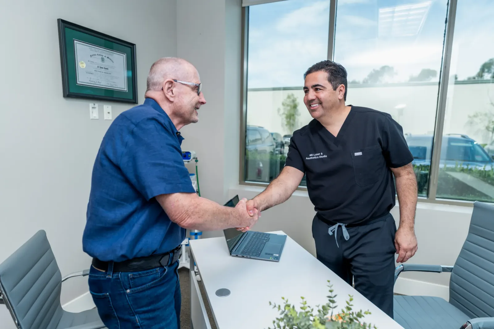 Dr. Hamidi greeting a patient in the treatment room