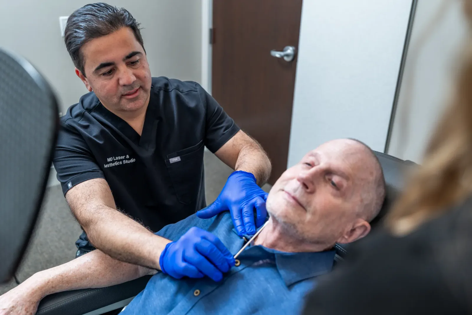Dr. Ali Hamidi performing a cosmetic injection on a patient